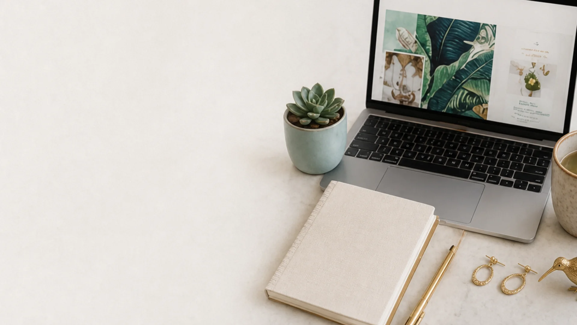 Laptop flatlay showing a cohesive wellness brand design by Lola Media